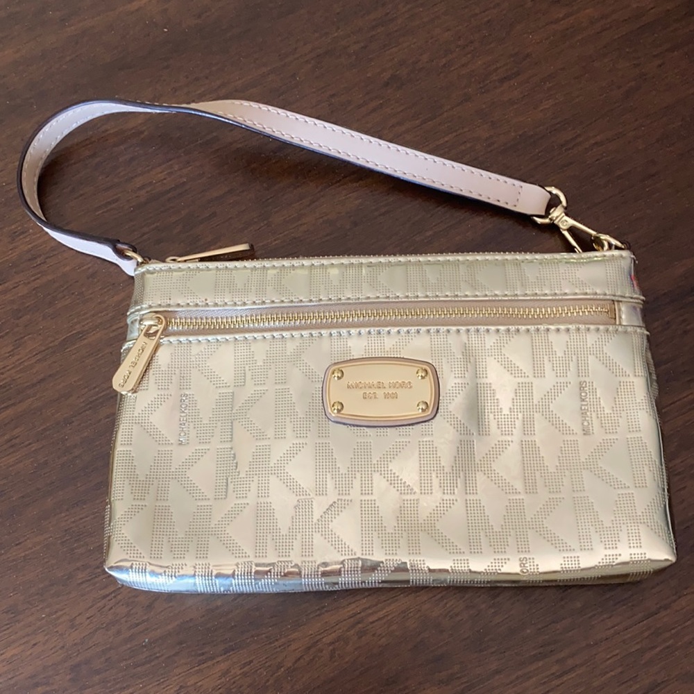 Micheal Kora metallic gold wristlet